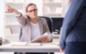 Someone is pointing at something in an office